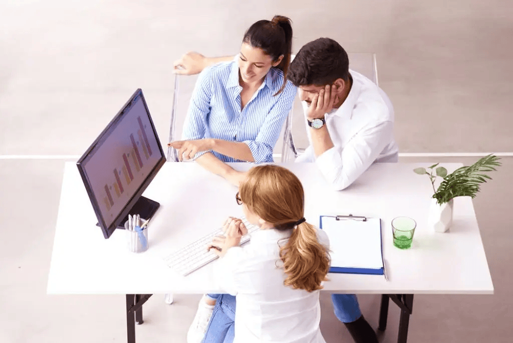 people discussing over a desk